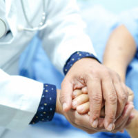 doctor-holding-touching-hands-asian-senior-old-lady-woman-patient-with-love-care-empa_39768-229